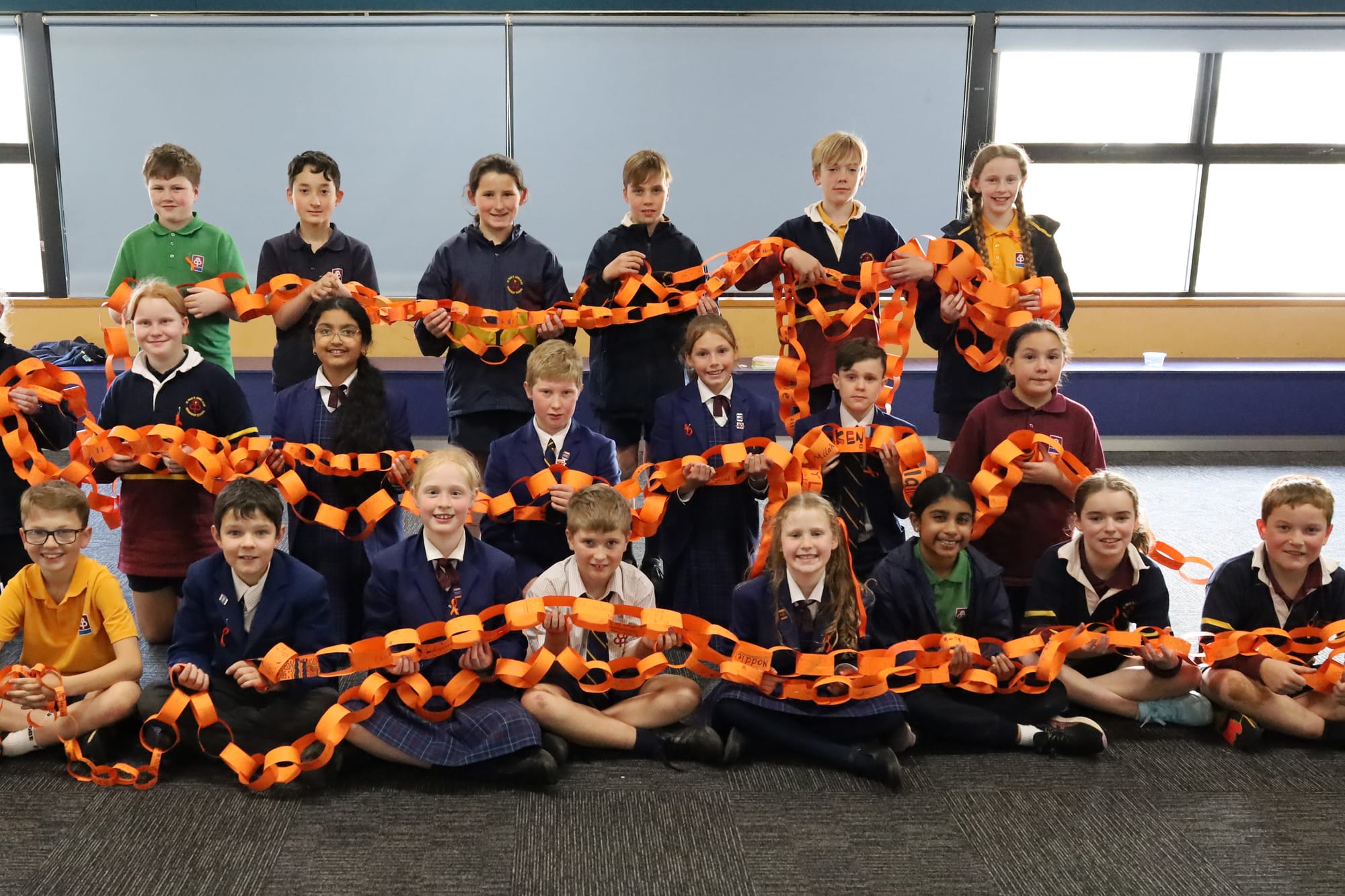 St Pauls Junior School SRC students with the whole-primary school friendship chain symbolising friendships and connections.