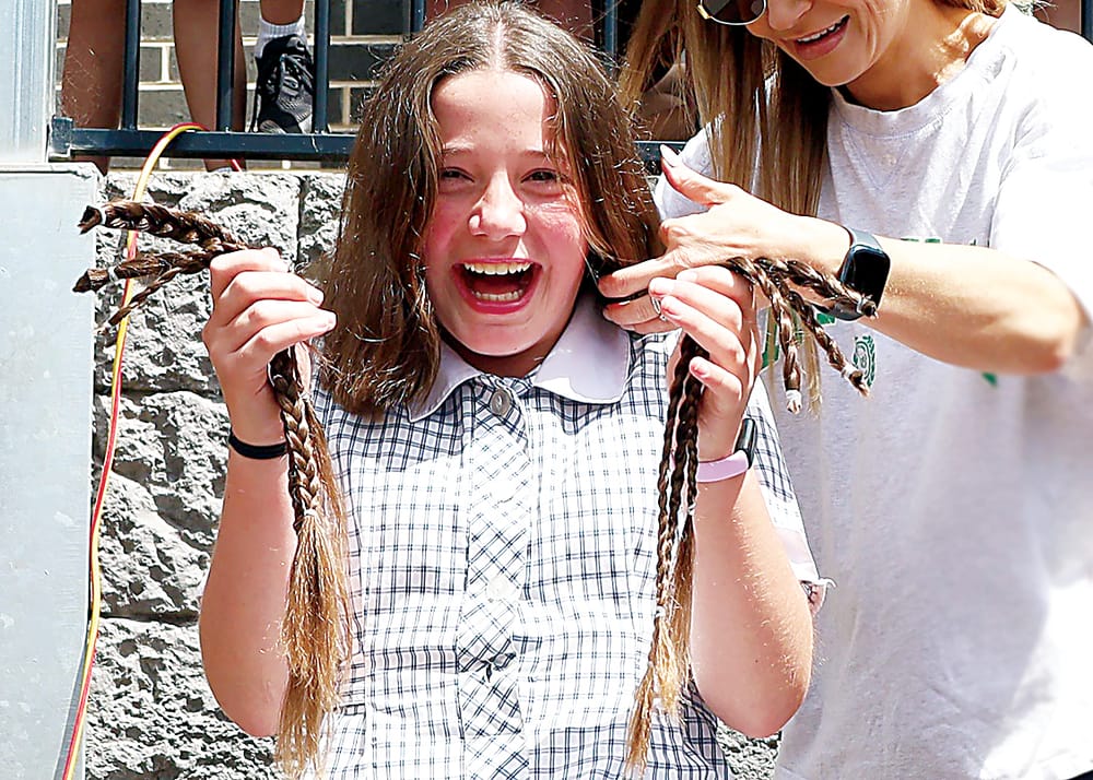 Mavis cuts hair in a show of heart post image