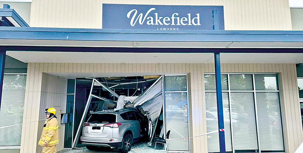 Car hits Drouin shop post image